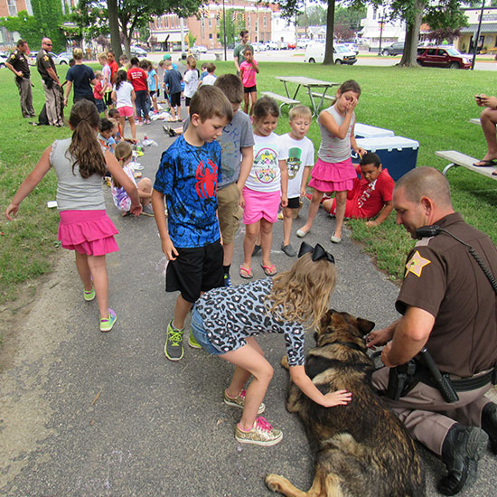 Kids petting the sheriff's dog