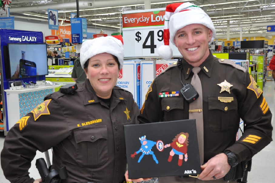 Kids enjoy Christmas Shopping with members of the Sheriff's Office